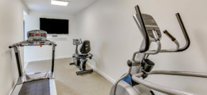 fitness room with tv