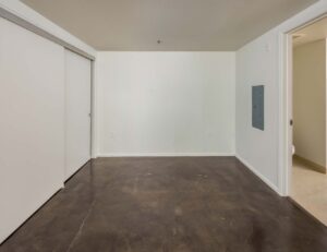 Crescent Cove large room with cement flooring
