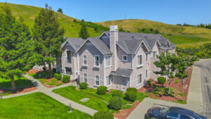 Building Exterior, 2 story walk-up, meticulous groomed grounds, sprawling hills in the background.